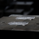 Wagner-Metallgiesserei AG  -  Guss Spülstutzen Pulverbeschichten Sandstrahlen Trovalisieren - Wagner-Metallgiesserei AG
